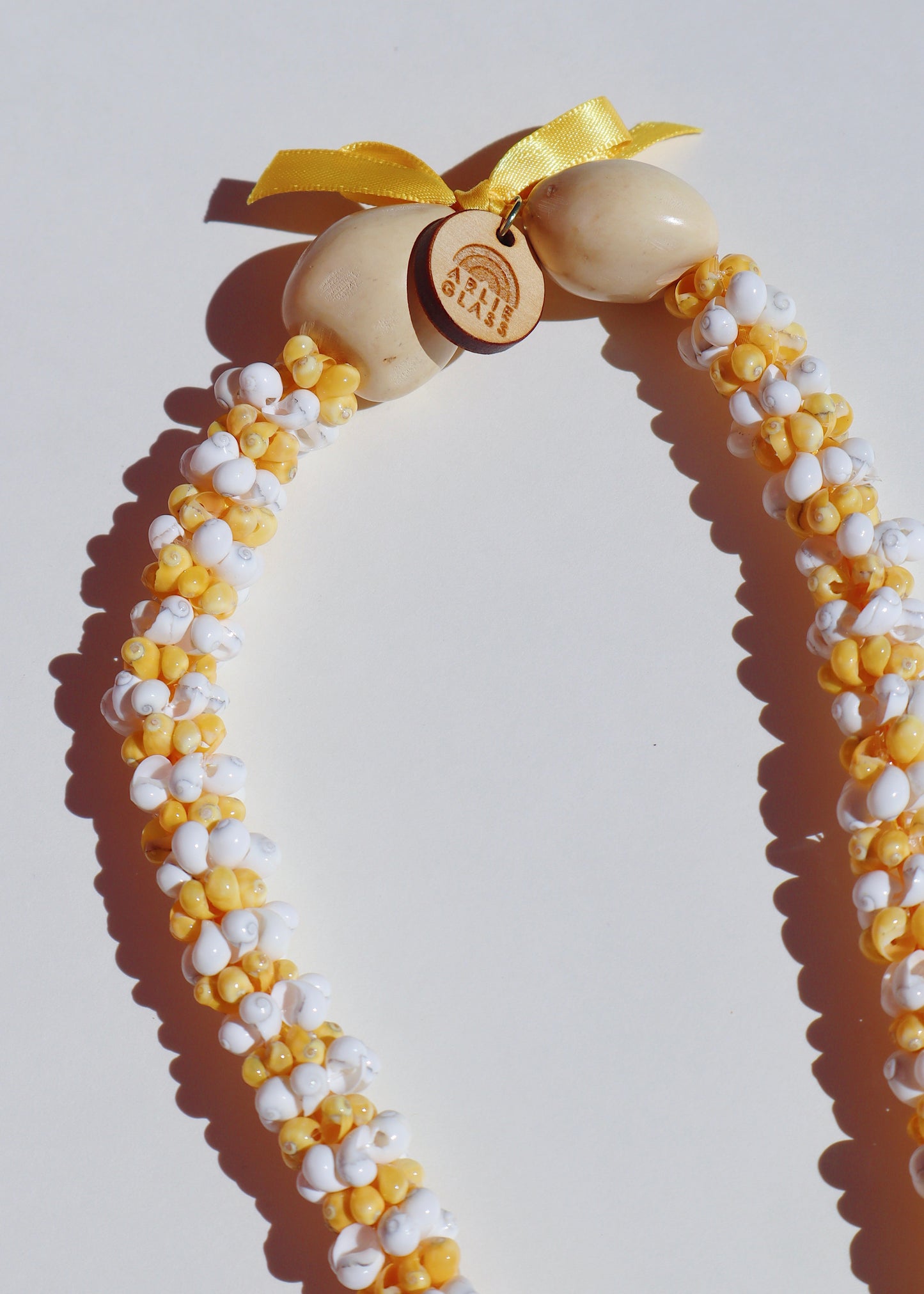 Mixed Color Puakenikeni Mongo Shell Lei with 3 Glass Pua