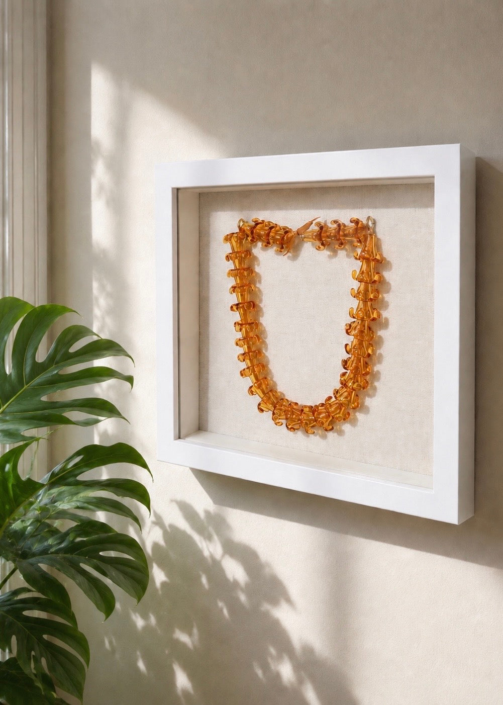 Puakenikeni Glass Lei in 9" x 9" Shadowbox