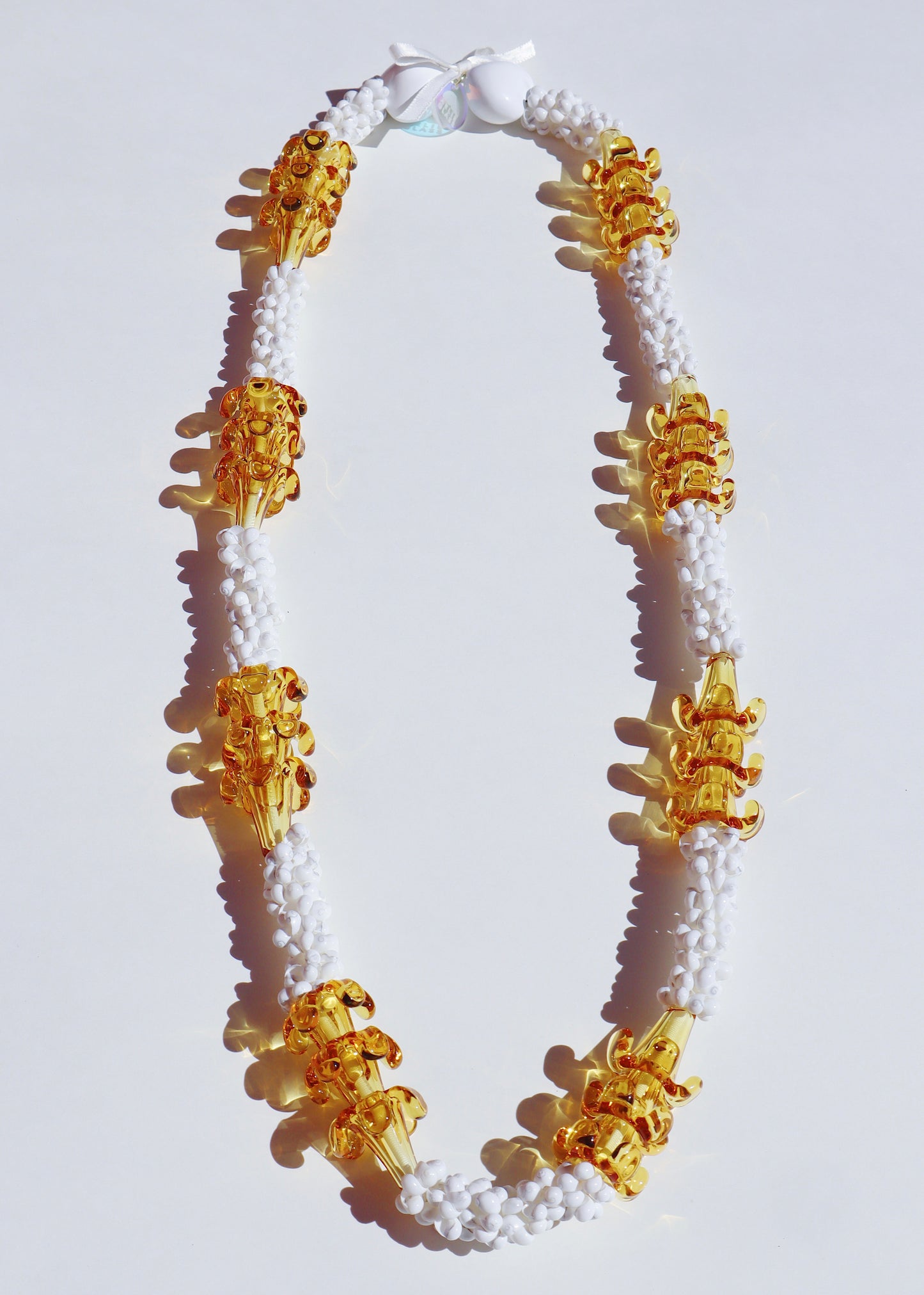 Puakenikeni Glass Mongo Shell Lei with 24 Pua