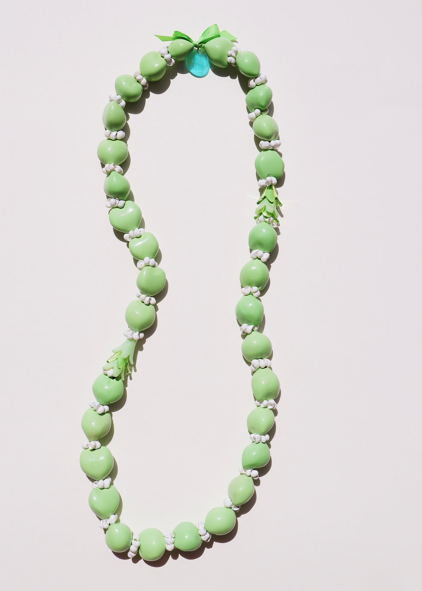 50% OFF - Pakalana Green Kukui Nut Lei with 6 Glass Pua