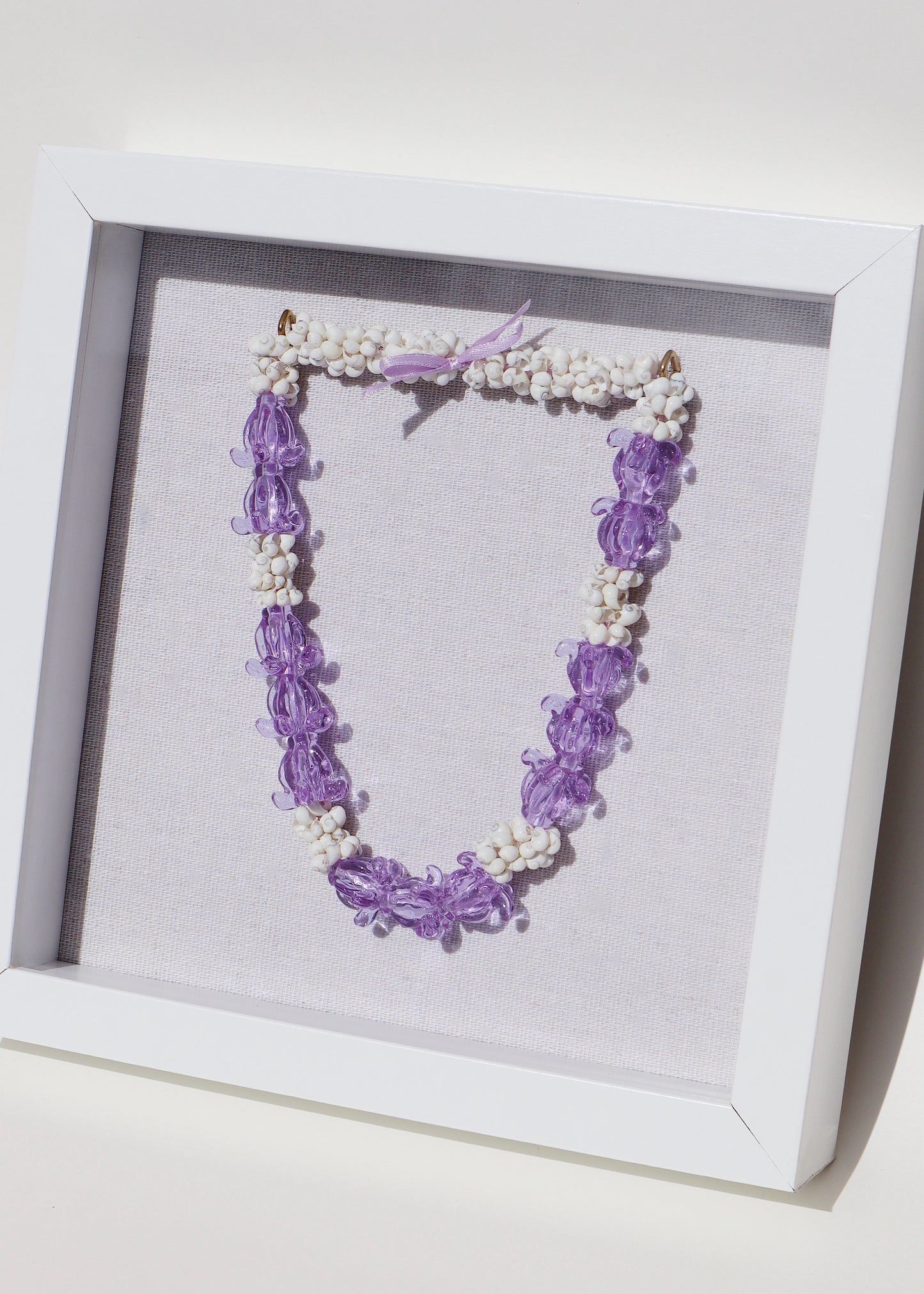 Pua Kalaunu Crown Flower Glass Lei in 9" x 9" Shadowbox