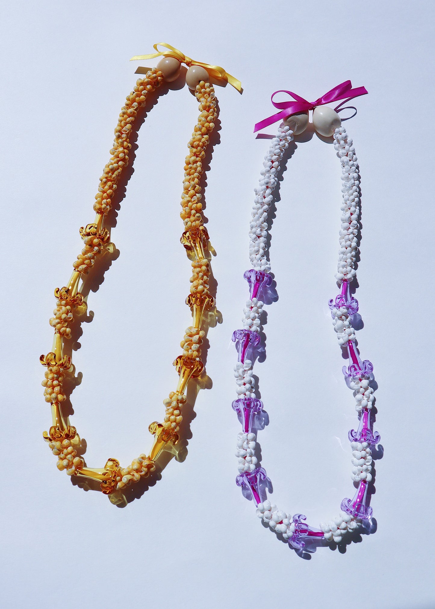 Lilac Glass Mongo Shell Lei with 9 Pua