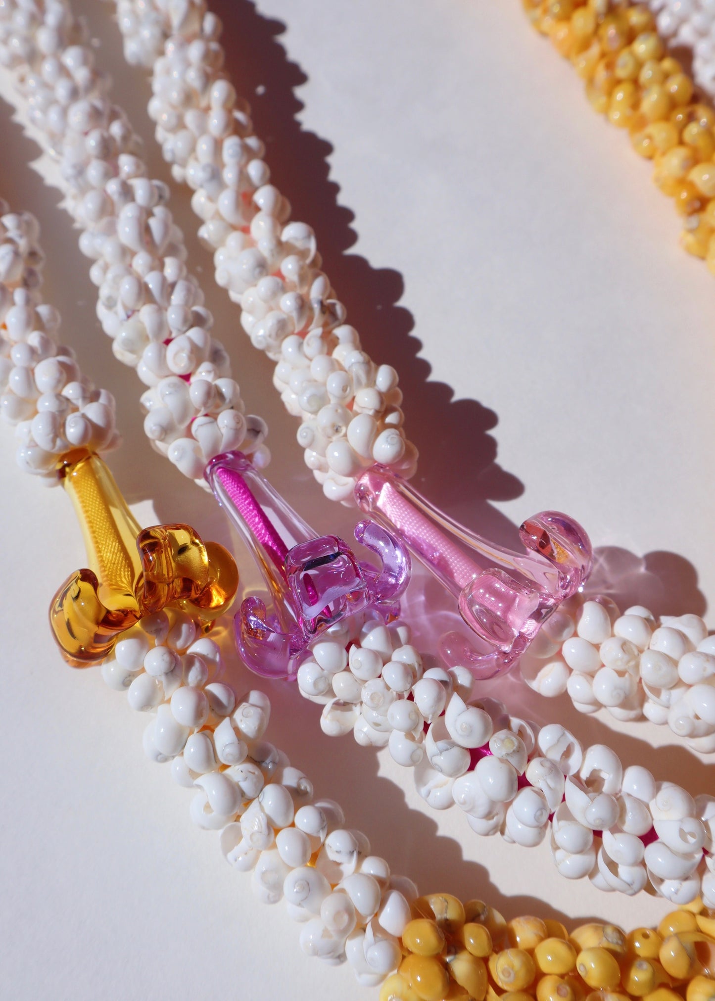 Puakenikeni Mongo Shell Lei with 1 Glass Pua