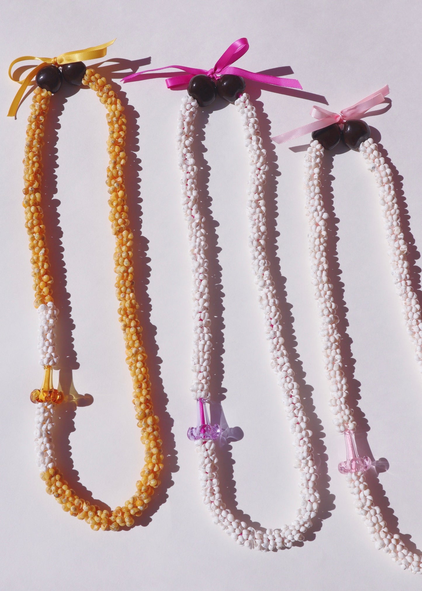 Puakenikeni Mongo Shell Lei with 1 Glass Pua