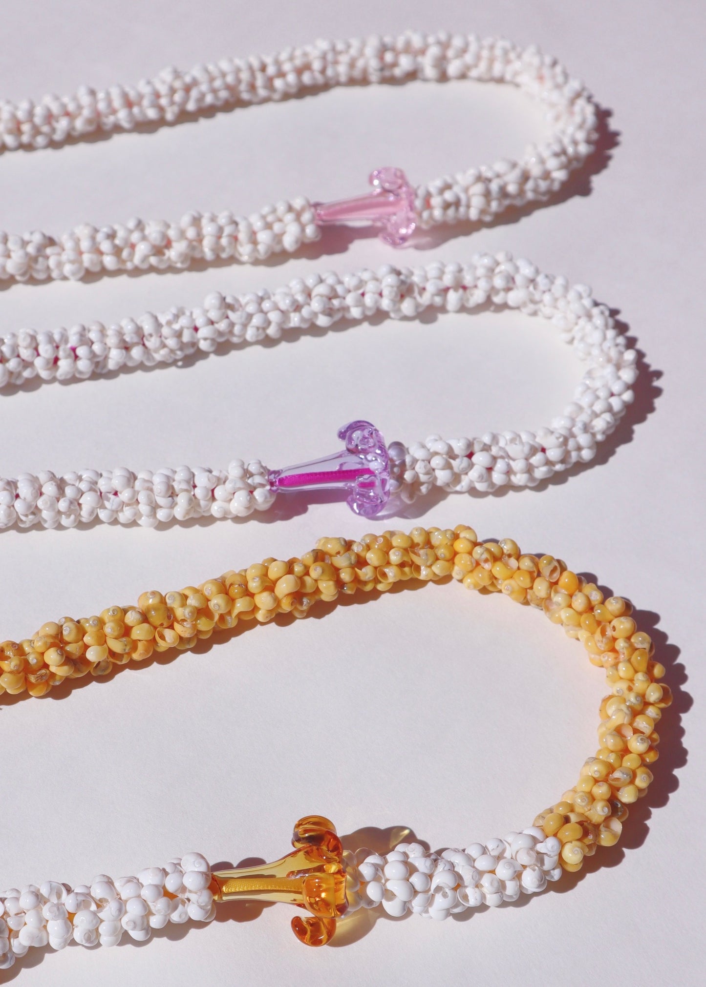 Puakenikeni Mongo Shell Lei with 1 Glass Pua