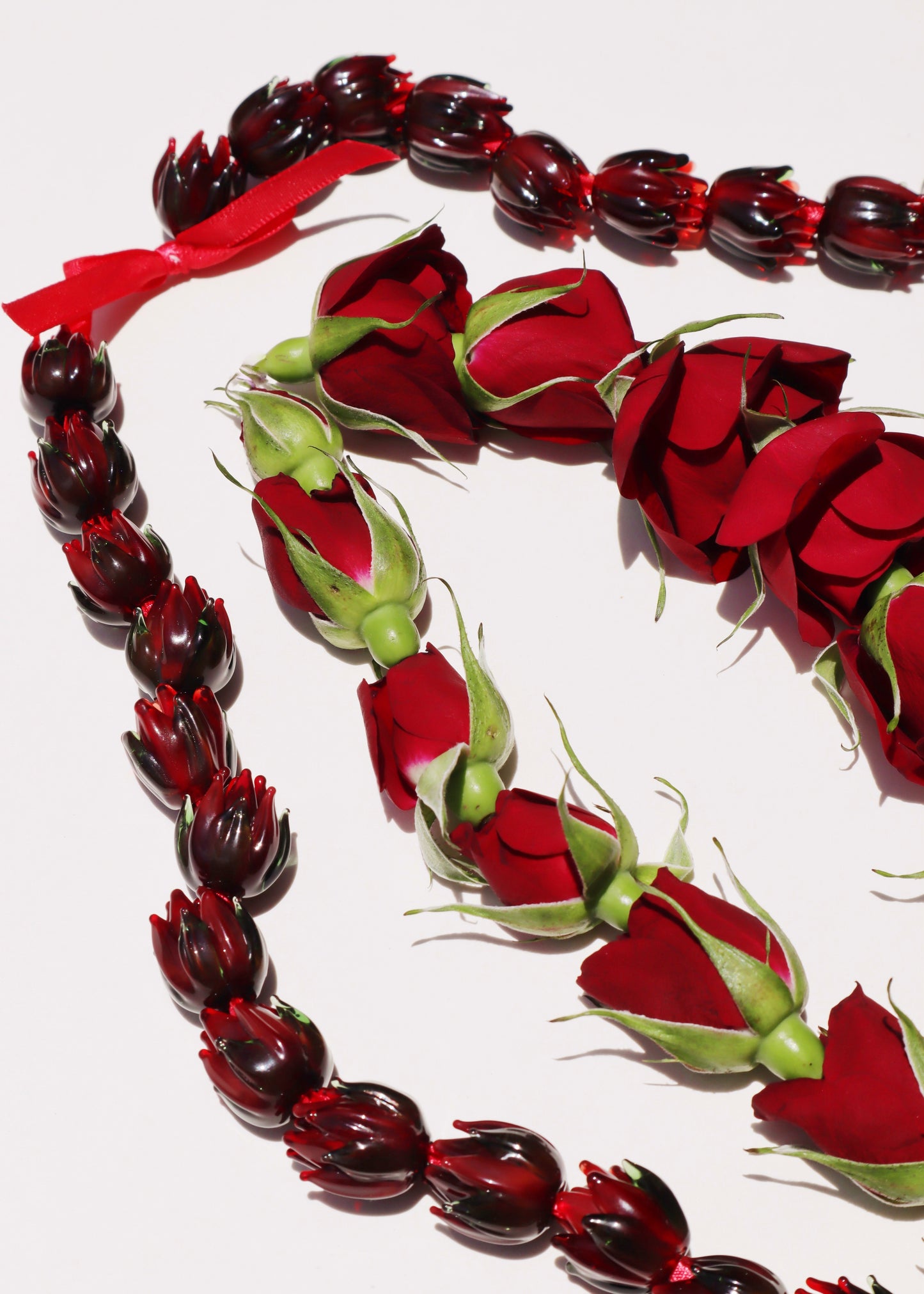 Full Glass Lokelani Rose Lei with 62 Pua