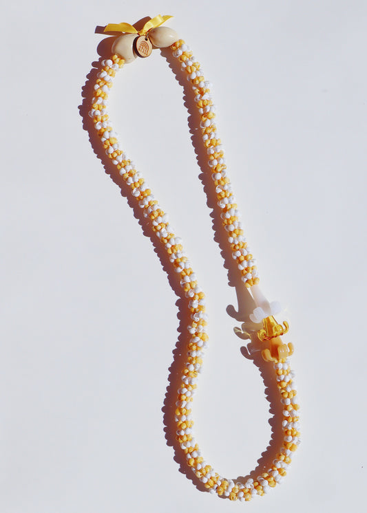 Mixed Color Puakenikeni Mongo Shell Lei with 3 Glass Pua