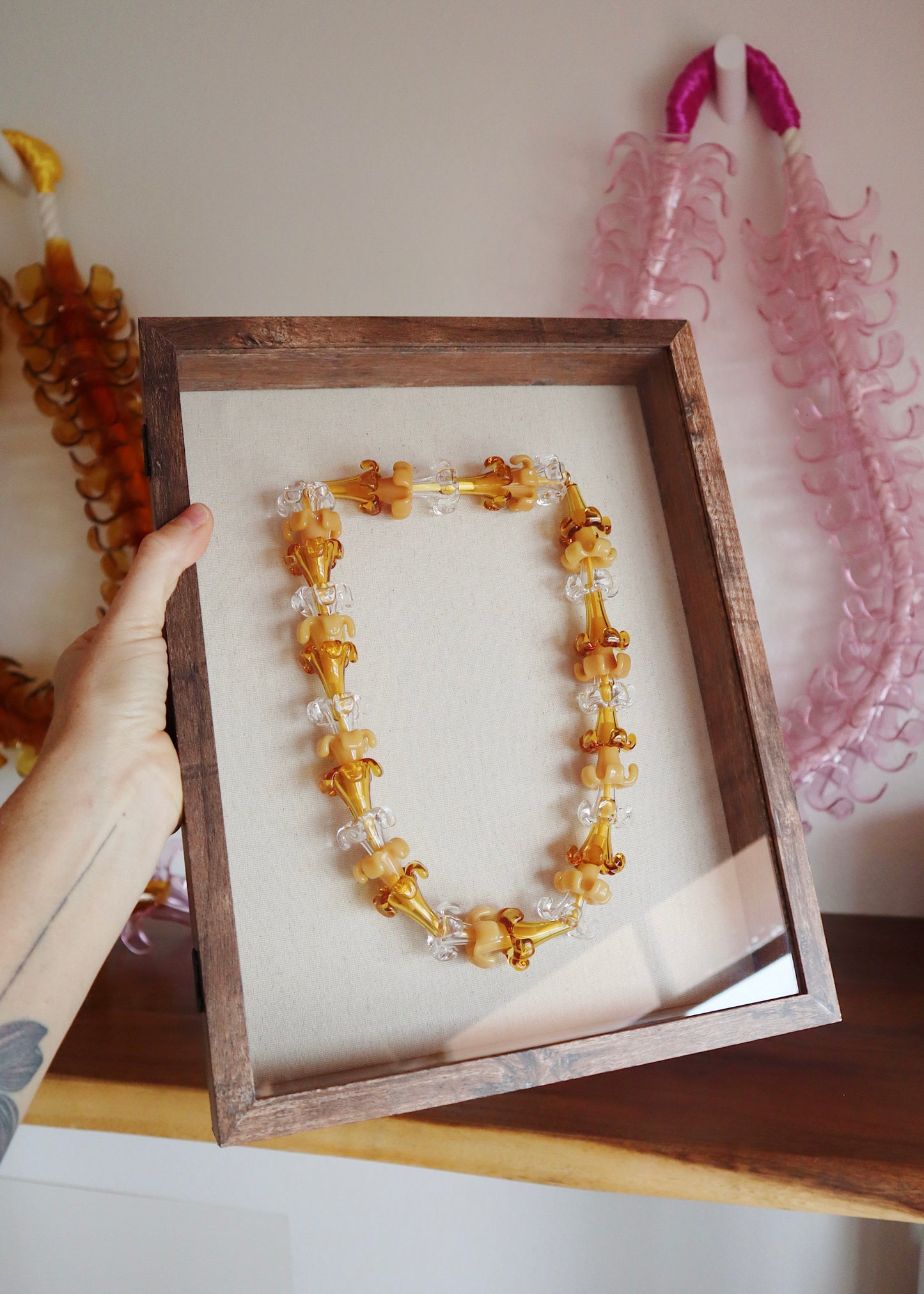 Mixed Puakenikeni Glass Lei in 11" x 14" Shadowbox
