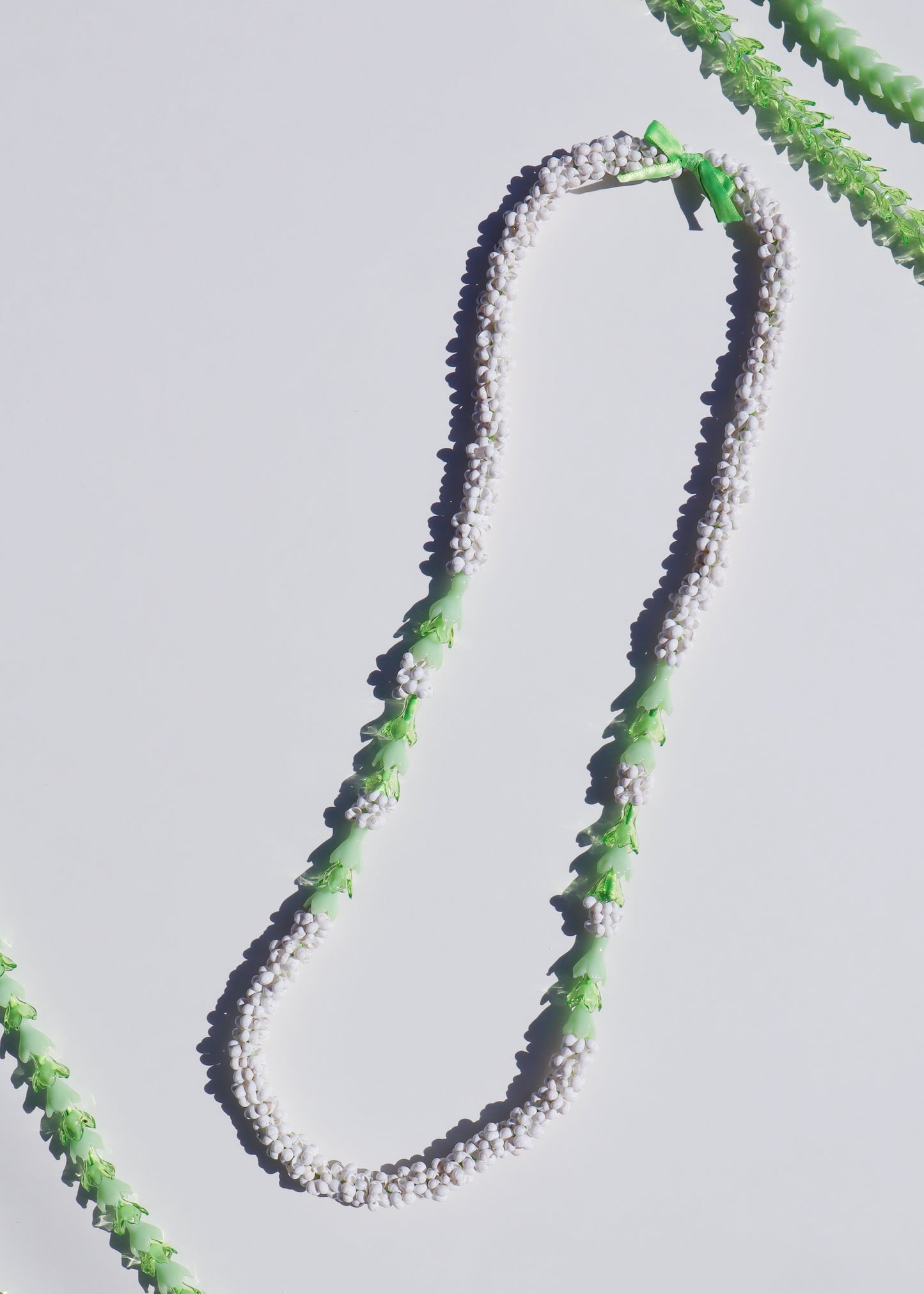 Pakalana Mongo Shell Lei with 18 Glass Pua