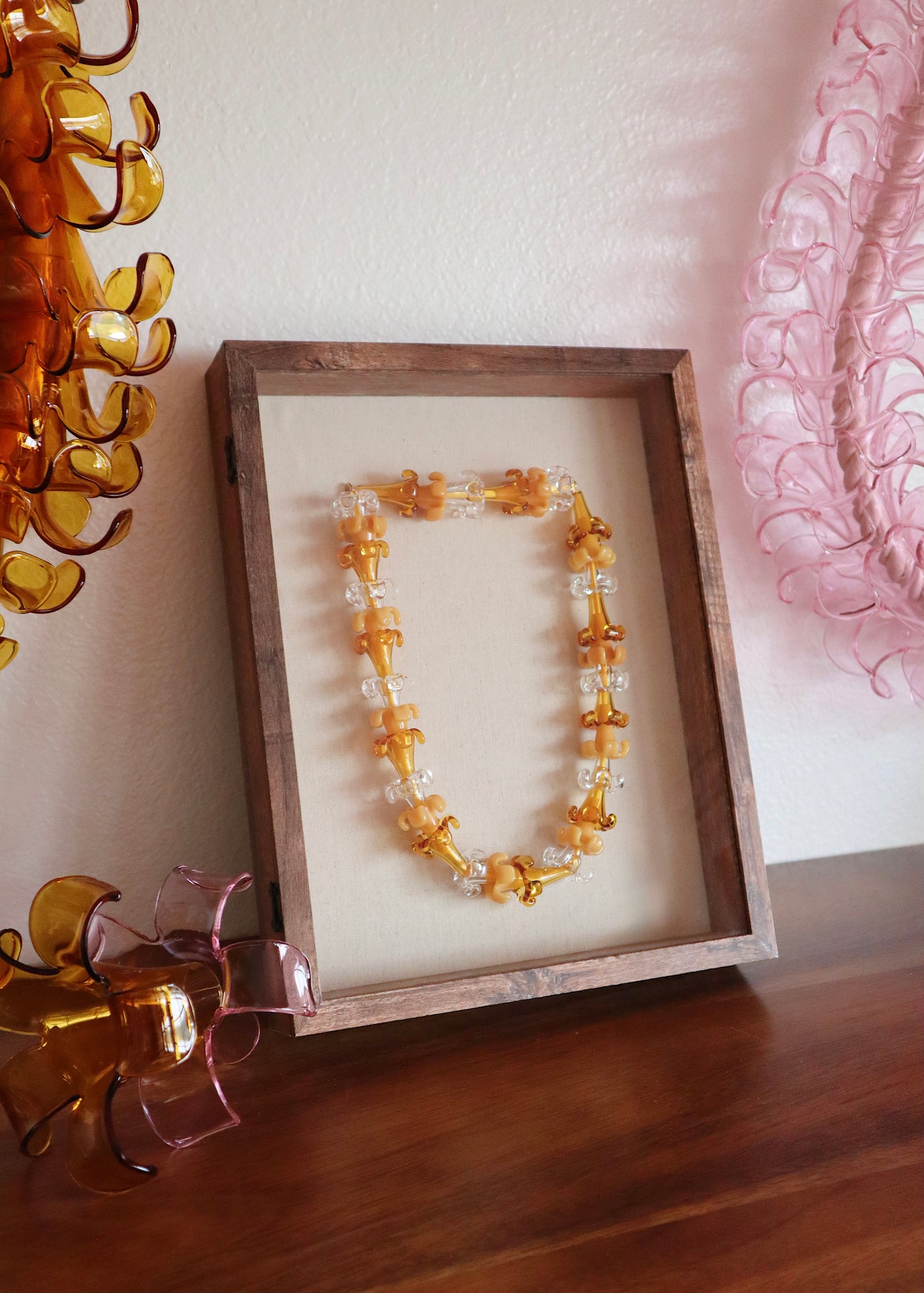 Mixed Puakenikeni Glass Lei in 11" x 14" Shadowbox