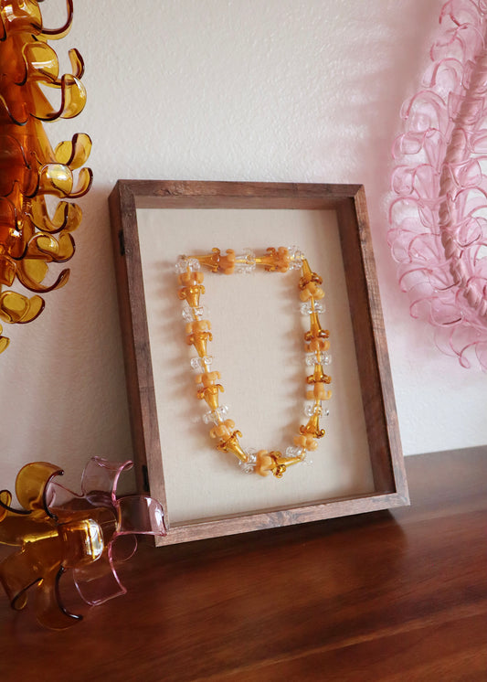 Mixed Puakenikeni Glass Lei in 11" x 14" Shadowbox