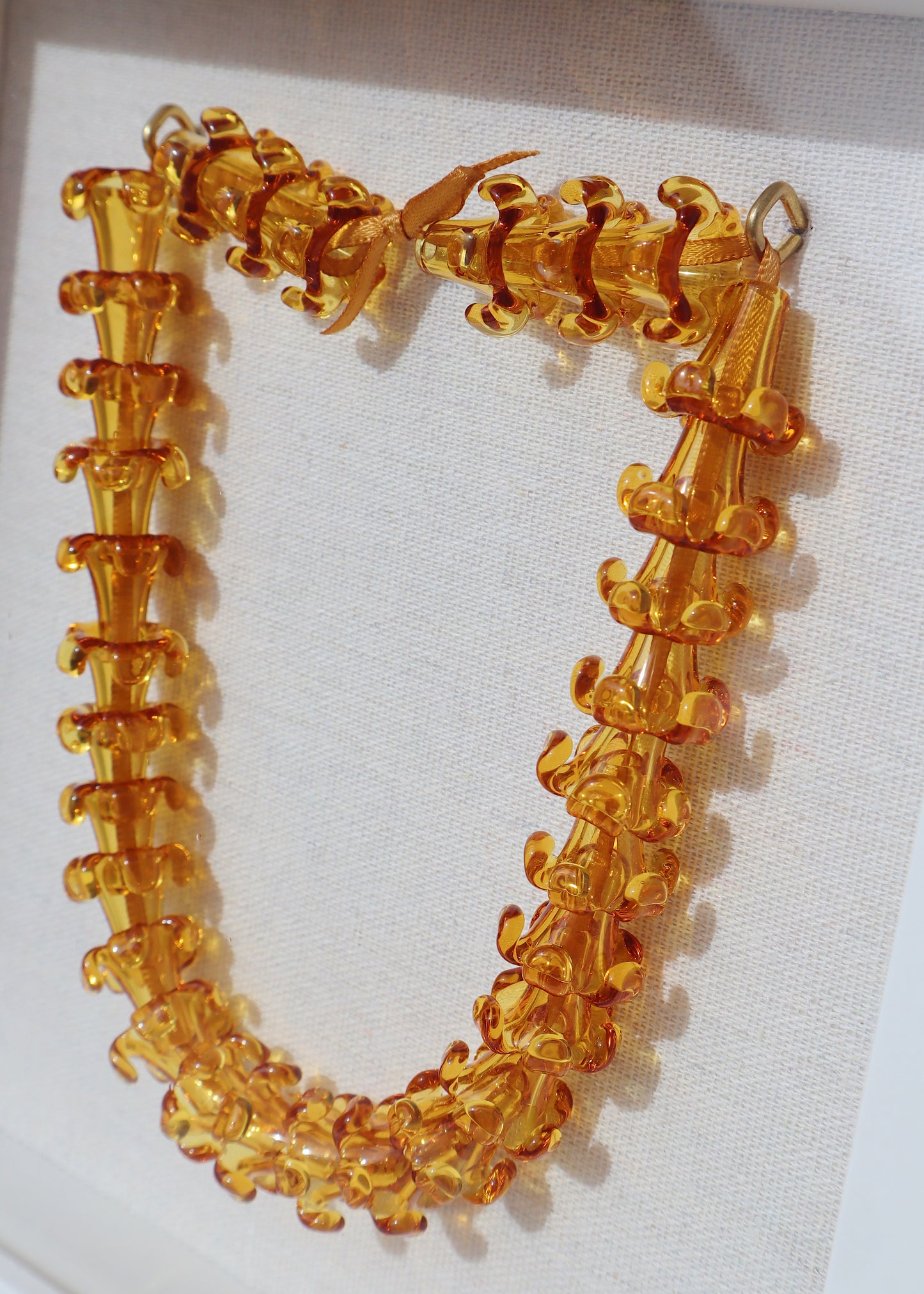 Puakenikeni Glass Lei in 9" x 9" Shadowbox
