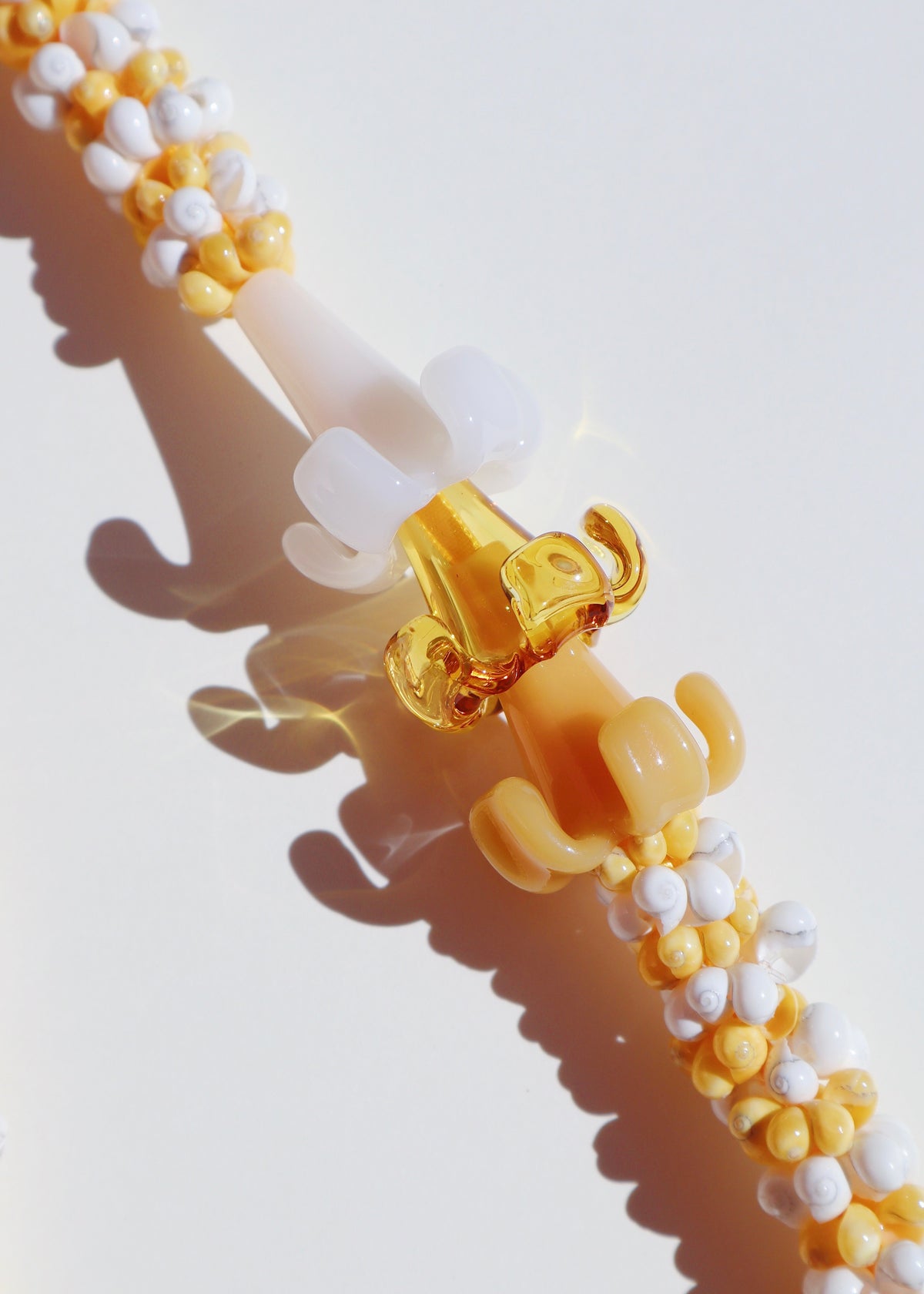 Mixed Color Puakenikeni Mongo Shell Lei with 3 Glass Pua