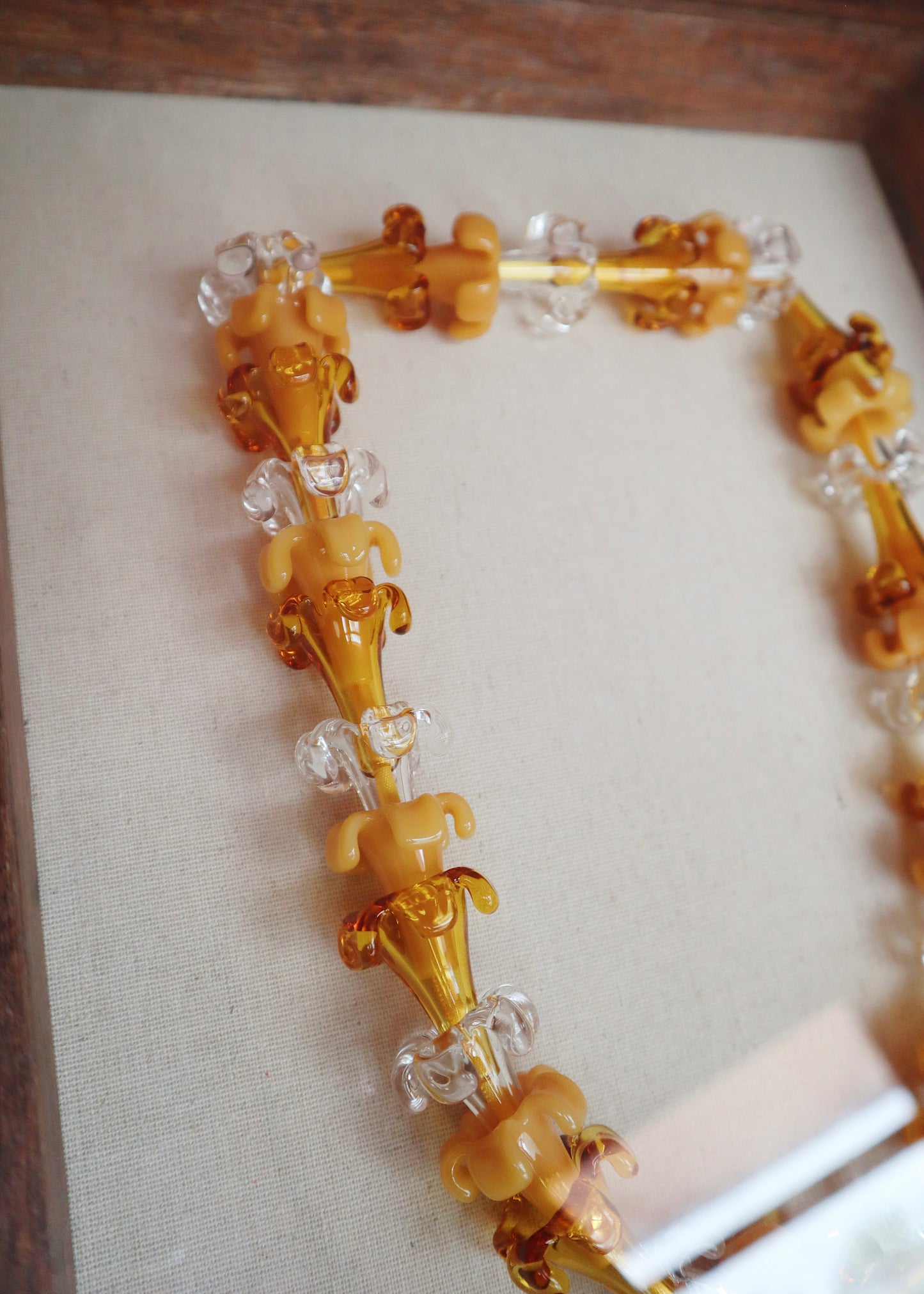 Mixed Puakenikeni Glass Lei in 11" x 14" Shadowbox