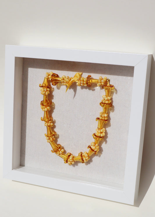 Puakenikeni Glass & Shell Lei in 9" x 9" Shadowbox