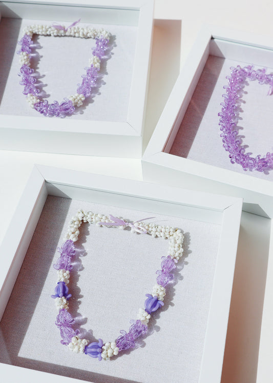 Pua Kalaunu Crown Flower Glass & Shell Lei in 9" x 9" Shadowbox