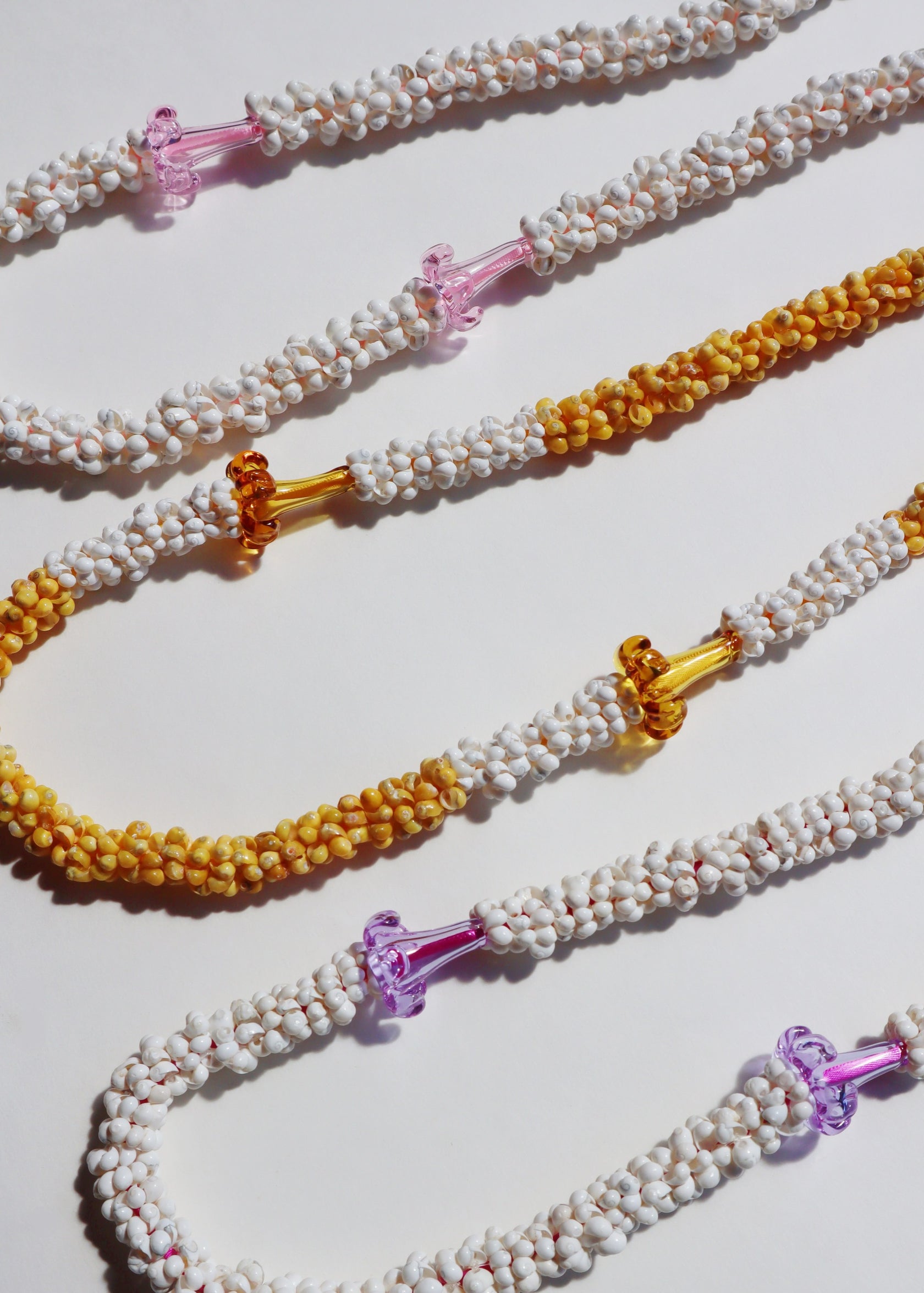 Puakenikeni Mongo Shell Lei with 2 Glass Pua – Arlie Pemberton