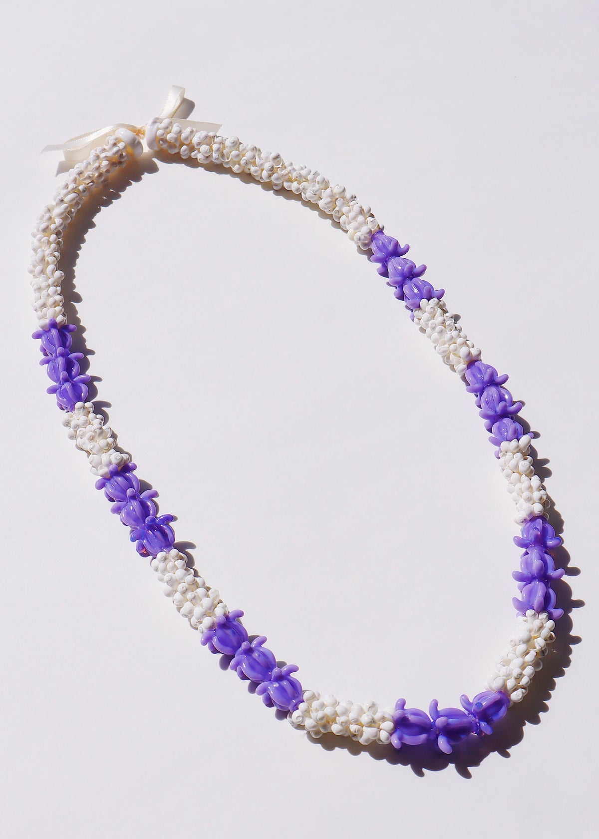 Crown Flower Mongo Shell Lei with 21 Glass Pua